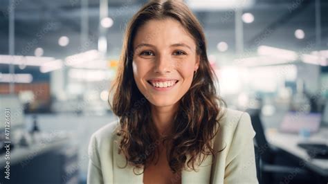 Portrait Of A Beautiful Happy Young Female Wearing White Jacket