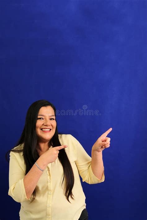 Year Old Latina Woman Points To Something That She Likes Surprises And Excites Such As