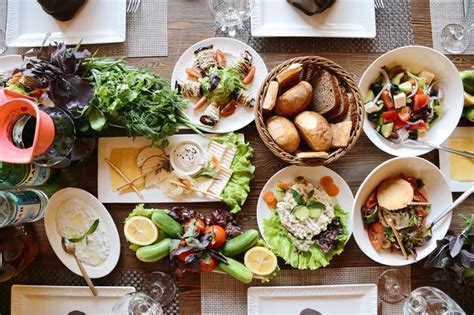 Premium Photo Abundant Feast Table Laden With Culinary Delights