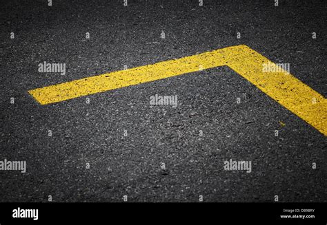 Road marking with yellow lines on dark asphalt Stock Photo - Alamy