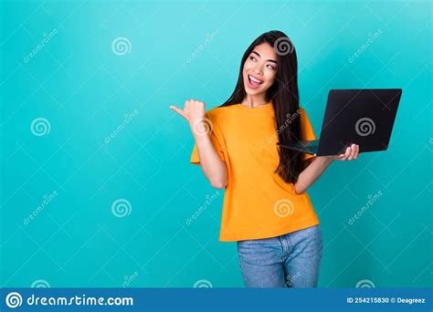 Photo Of Impressed Millennial Lady Index Empty Space Hold Laptop Wear