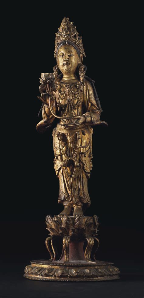 A RARE GILT LACQUERED BRONZE STANDING FIGURE OF GUANYIN MING DYNASTY