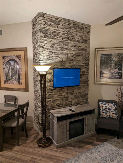 Corner Accent Wall Using Arctic Smoke Stacked Stone Living Room