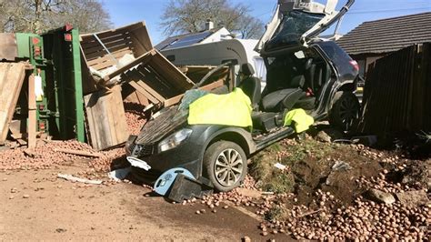 Motorist Suffers Serious Injuries After Wood Spills Out Of Tractor