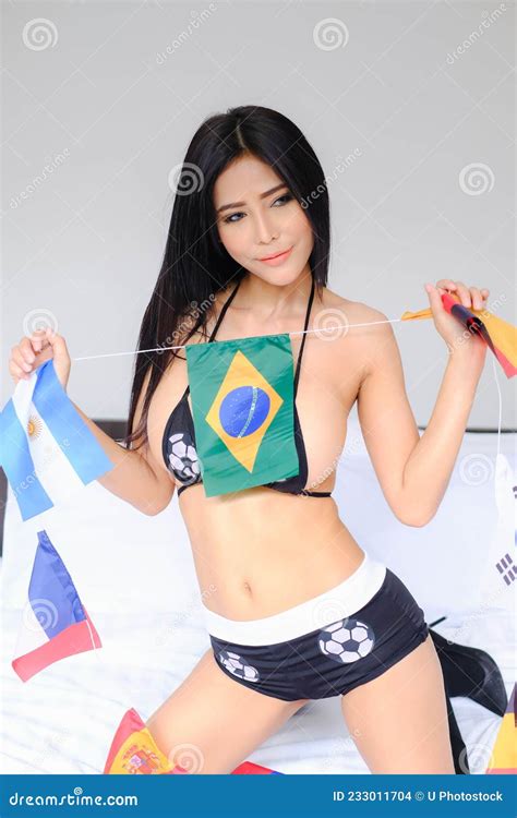 Portrait Woman Wearing Bikini On The Bed With Bunting International
