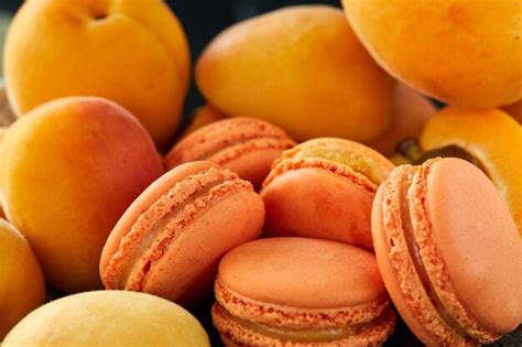 Premium Photo Delicious Macaron With Apricot Flavor On A Light Background