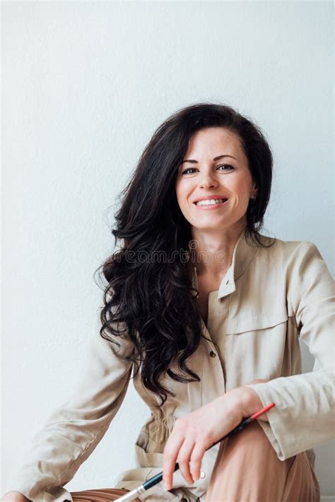 Artist With Paint Brushes Sitting In Studio Stock Image Image Of