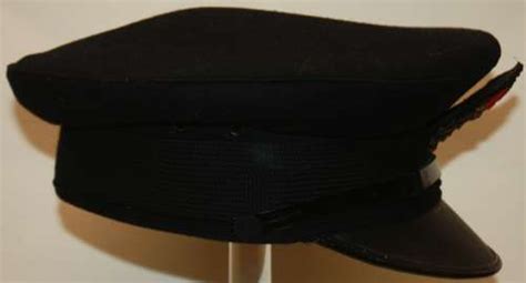 A GOOD WWII PERIOD ROYAL NAVY PETTY OFFIERS PEAKED CAP