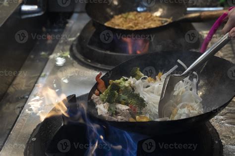 wok rice spaghetti cooking 17415256 Stock Photo at Vecteezy