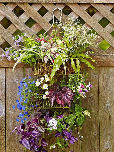 A Hanging Basket Filled With Lots Of Different Types Of Flowers On Top