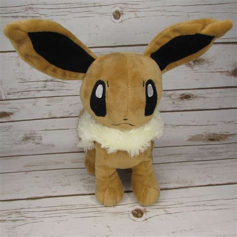 Pokemon Center | Toys | Pokemon Center Eevee 2 Sitting Plush Nintendo | Poshmark