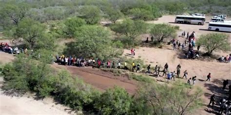 Drone Footage Shows A Large Group Of Migrants Crossing The Us Mexico