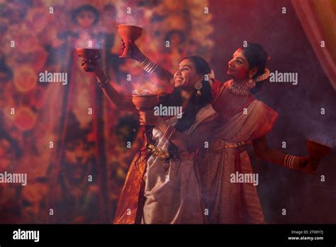 Bengali Women Performing Dhunuchi Dance On The Occasion Of Durga Puja