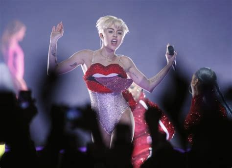 Miley Cyrus Shows Off Her Massive Tongue In A Bizarre Outfit