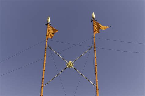 Top part of Nishan Sahib at Golden Temple in Amritsar Photograph by ...