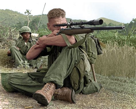 Marine Lance Corporal Dalton Gunderson checking the area for Viet Cong ...