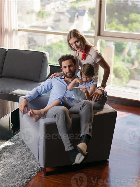 Family in livingroom 10707872 Stock Photo at Vecteezy