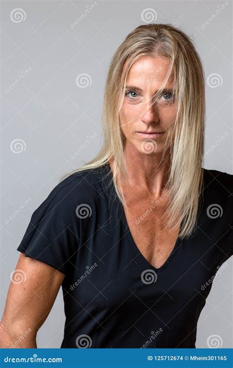 Attractive Tanned Woman With Long Blond Hair Stock Photo Image Of Intently Mature 125712674