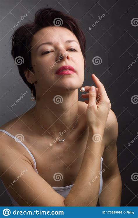 Brunette With Short Hair Studio Portrait In White T Shirt Stock Photo