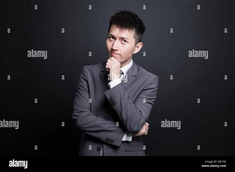 Chinese Businessman Thinking Stock Photo Alamy
