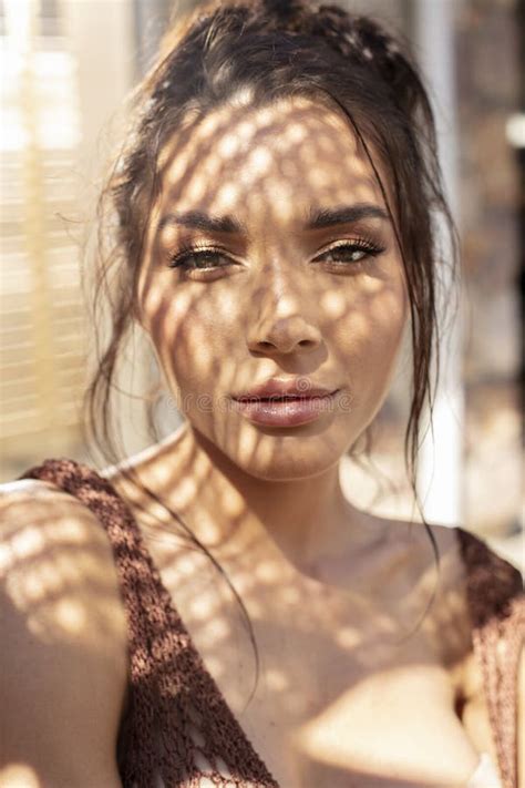 Beauty Portrait Of Brunette Woman With Beautiful Eyes Looking At Camera Posing At Sunny Summer