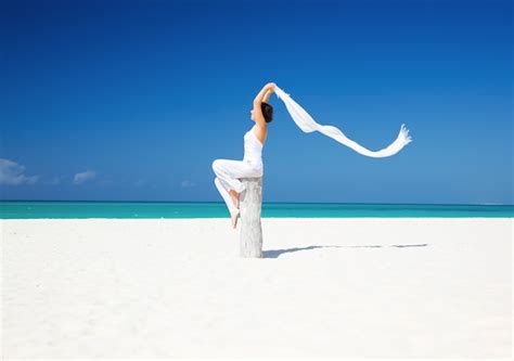 Premium Photo Happy Woman With White Sarong On The Beach