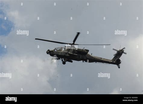 Ah 64 Apache Helicopters Fire The M230 130mm Chain Gun At Targets