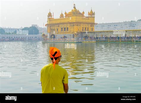 Sikh Pilgrim Praying In Holy Tank Near Golden Temple Sri Harmandir