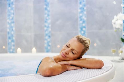 Premium Photo A Woman Relaxing In The Hot Tub With Her Eyes Closed Wellness And Spa