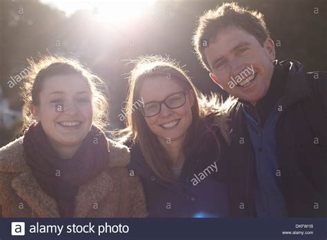 Friends On Day Trip In Devon Uk Wearing Winter Clothing Stock Photo