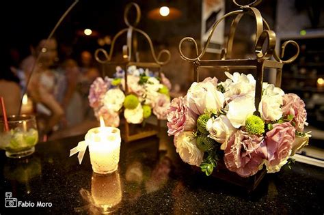 Flowers And Candles Are Sitting On A Table