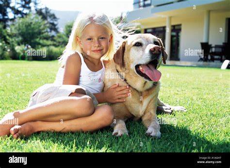 Girl with labrador Stock Photo - Alamy