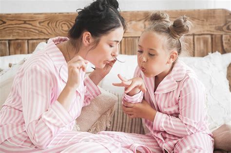 Premium Photo Mother And Daughter Makeup Together Girl`s Little