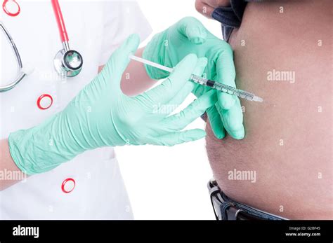 Female Doctor Making Injection In Abdomen To A Diabetes Patient As