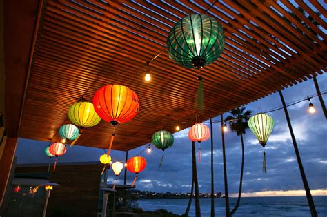 Hanging Paper Lanterns From Wood Ceiling