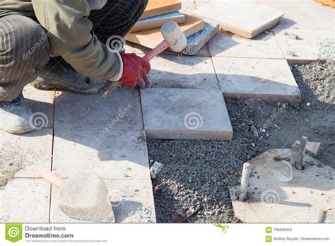 Worker Puts Sidewalk Tile Stock Image Image Of Cement 106595453