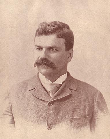 An Old Photo Of A Man With A Mustache