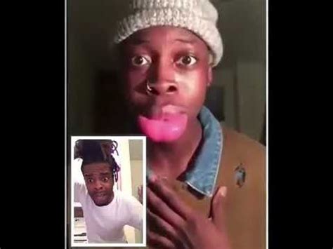 a man is taking a selfie with his pink tongue