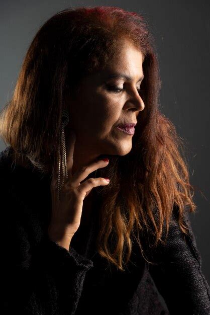 Premium Photo Closeup Portrait Of Mature Woman In Studio Concentrated And Sensual Isolated On