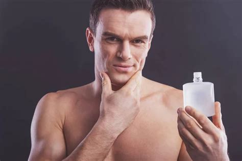 Portrait Handsome Naked Man Holding Spray Antiperspirant Showing Sign