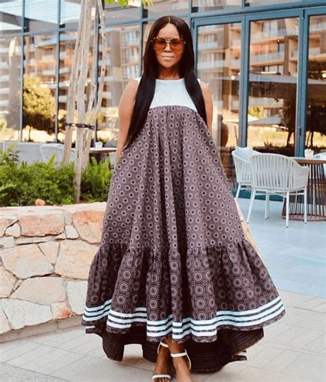 Clipkulture Lady In Beautiful Brown And White Sleeveless Shweshwe