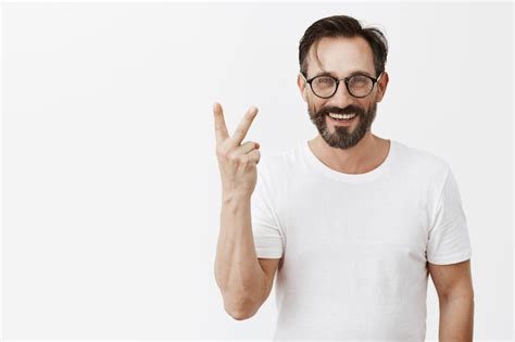Free Photo Handsome Happy Bearded Mature Man With Glasses Posing