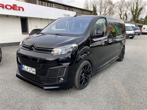 Black Van Parked In Front Of A Building