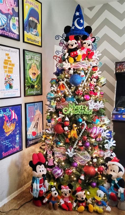 A Christmas Tree With Mickey Mouse Decorations On It