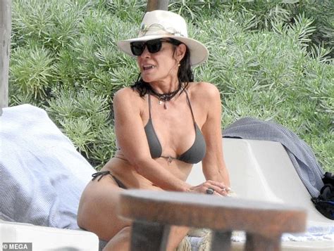 Luann De Lesseps Parades Around In String Bikini After Jetting From New York City Stomping
