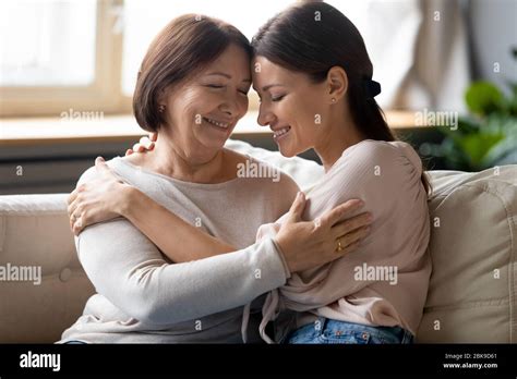 Happy Older Mother And Adult Daughter Hugging Enjoying Tender Moment