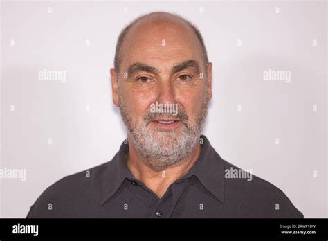 Oliver Parker Poses For Photographers Upon Arrival At The World