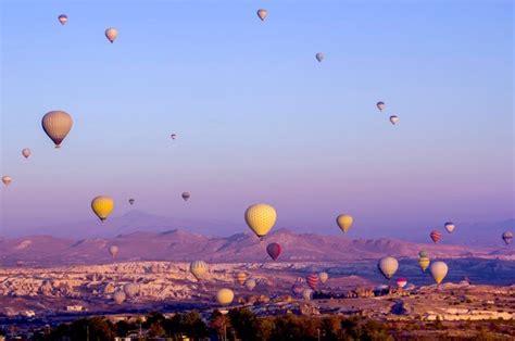 Premium Photo Hot Air Balloons Flying Over Landscape