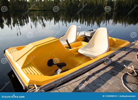 Yellow Paddle Boat In The Summer On A Lake Stock Photo Image Of