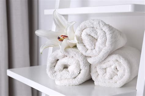 Premium Photo Clean White Towels On Shelf